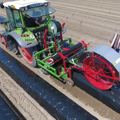 Poly film layer Leopard with accessories: hole puncher and drip hose feeder in the field